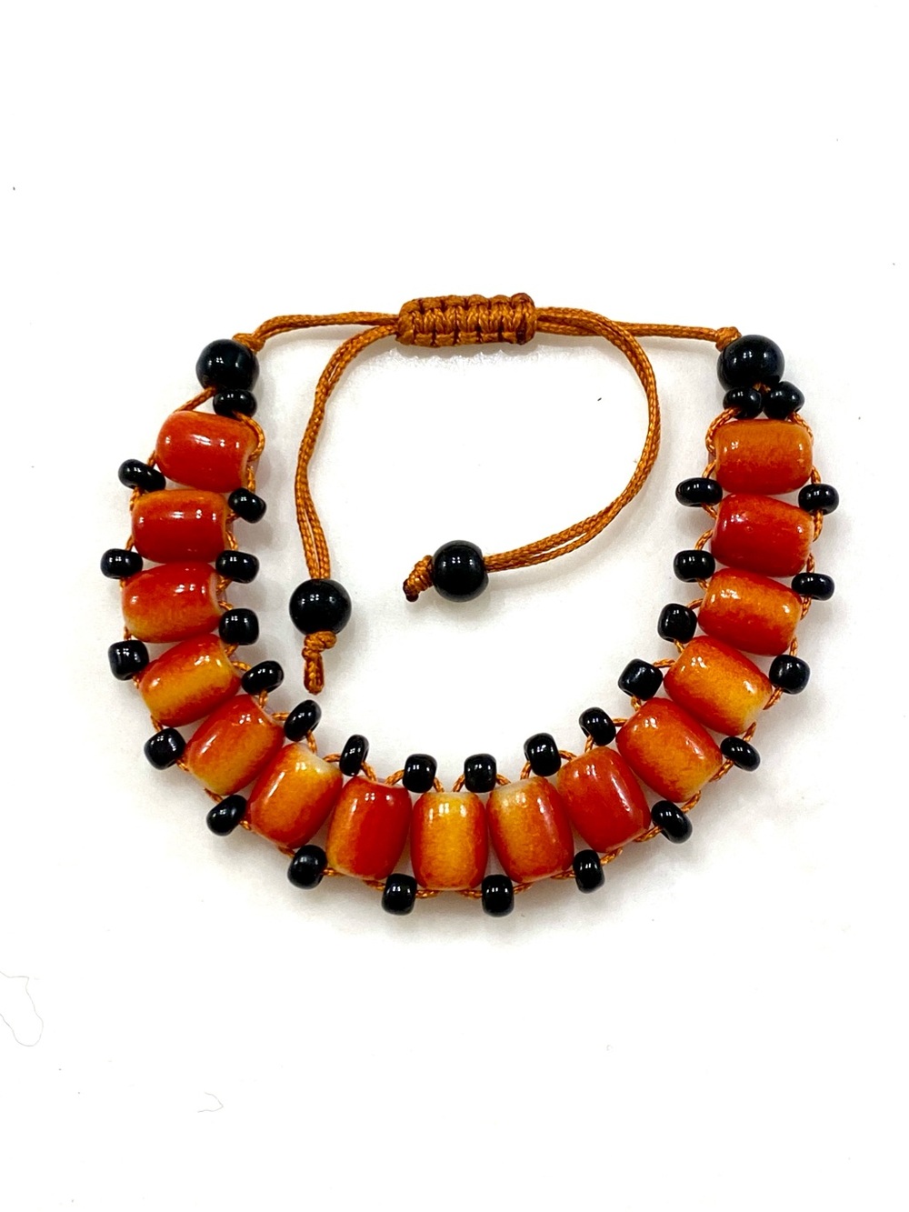Adjustable Orange Barrel Bead Bracelet with Black Spacers